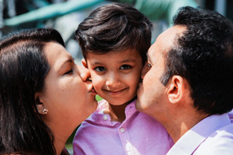 parents kissing child