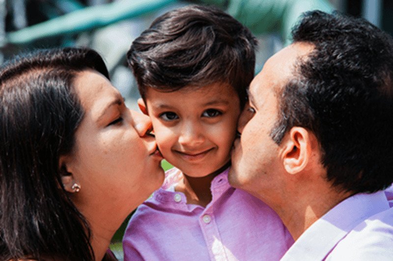 Should Parents Consider a Biomedical Approach for Their Neurodiverse Child? 1 parents kissing child